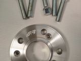 four screws and two nuts on the top of a wheel
