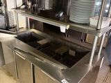 a kitchen with stainless steel cabinets and a counter top