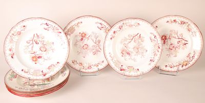 several plates are lined up on top of each other on a table