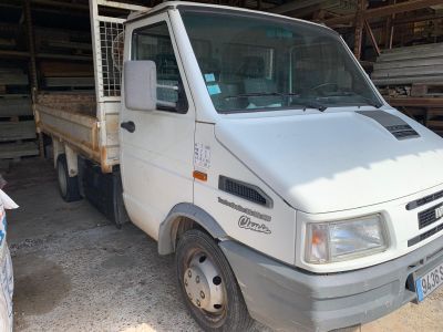 a white truck that is parked in a garage