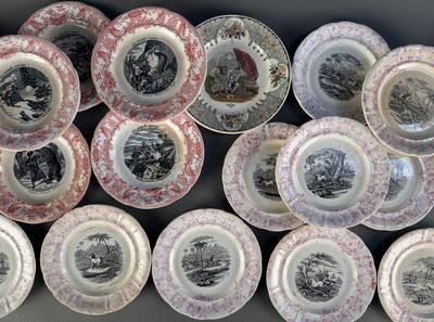 a lot of plates that are sitting on a table