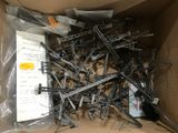 a cardboard box filled with assorted pieces of construction equipment