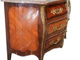 an image of a wooden chest of drawers with a marble top