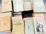 a lot of books that are sitting on a table