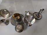 a lot of silver items that are on the table
