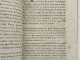 an open book with writing on it sitting on top of a table