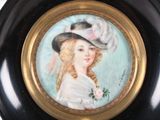 a painting of a woman wearing a hat on a wall