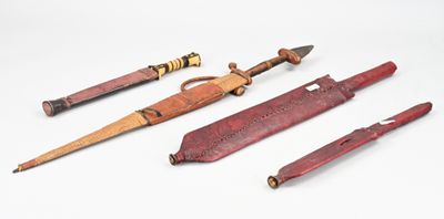 several different types of knives are lined up on a white surface