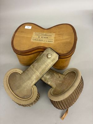 two wooden brushes and a wooden box on a white surface
