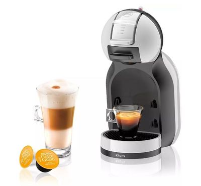 an image of a coffee machine with a cup of coffee next to it