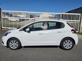 a white car is parked in front of a gate