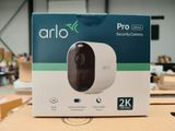 the arlo pro security camera is in the box on the table