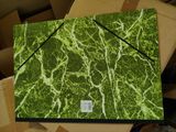 a picture of a green and white marbled surface on a box