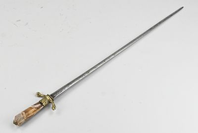 a close up of a knife on a table with a white background
