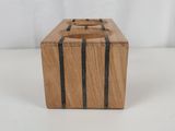 an image of a small wooden box with a black stripe on it