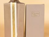 a close up of a box with a book inside of it