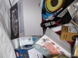a pile of assorted items sitting on a bed