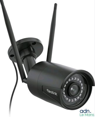 an image of a security camera mounted to the side of a wall