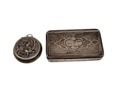 an image of a small silver box with a picture on it
