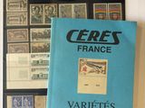 a book on a table with a bunch of stamps on it