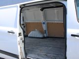 a white van with the door open in a parking lot