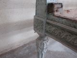 a white bench that is sitting in the corner of a room