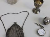 a lot of silver items that are on the table