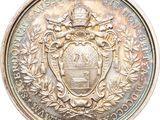 an image of a medal with a coat of arms on it