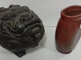 two vases sitting next to each other on a table