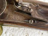 a close up of a gun on a white surface