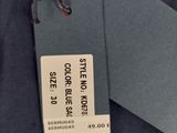 the label on the jacket is attached to the tag