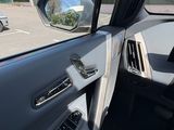 a view of the inside of a car from the driver ' s seat
