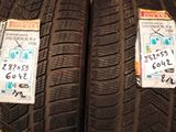 two tires with stickers on them are on display in a store
