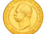 l'image d'une pièce d'or sur laquelle figure le portrait d'un homme