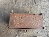 an old metal box that has a star design on it