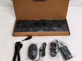 a box with a keyboard, mouse, and other items in it