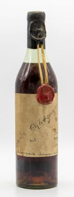 an old bottle of liquor with a wax seal on it