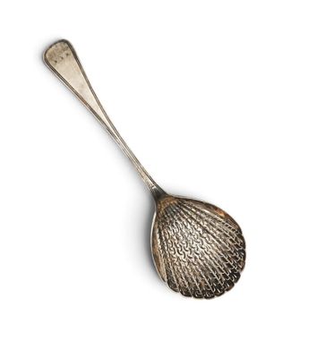 a close up of a spoon on a white surface