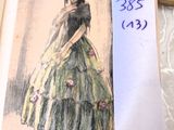 a drawing of a woman in a green dress on a table