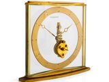 a gold clock with a clock face on it