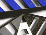 a picture of a blue and white wall with a triangle