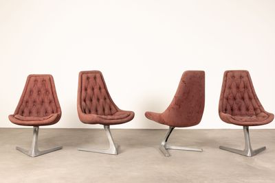 set of four mid - century style chairs with tufted upholstered upholstered seats