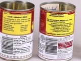 two tins of food that are sitting on a table