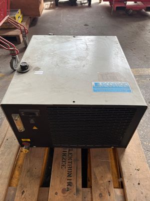 a machine that is sitting on a pallet in a warehouse