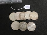 a lot of coins that are sitting on a table