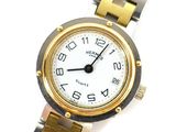 an image of a close up of a wrist watch on a white surface