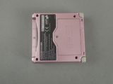 a pink electronic device that is sitting on a table