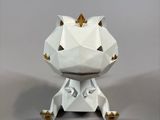an origami paper sculpture of a cat sitting on its hind legs