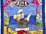 an image of a blue scarf with a picture of a pirate ship
