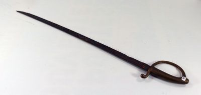 a small sword that is sitting on a table